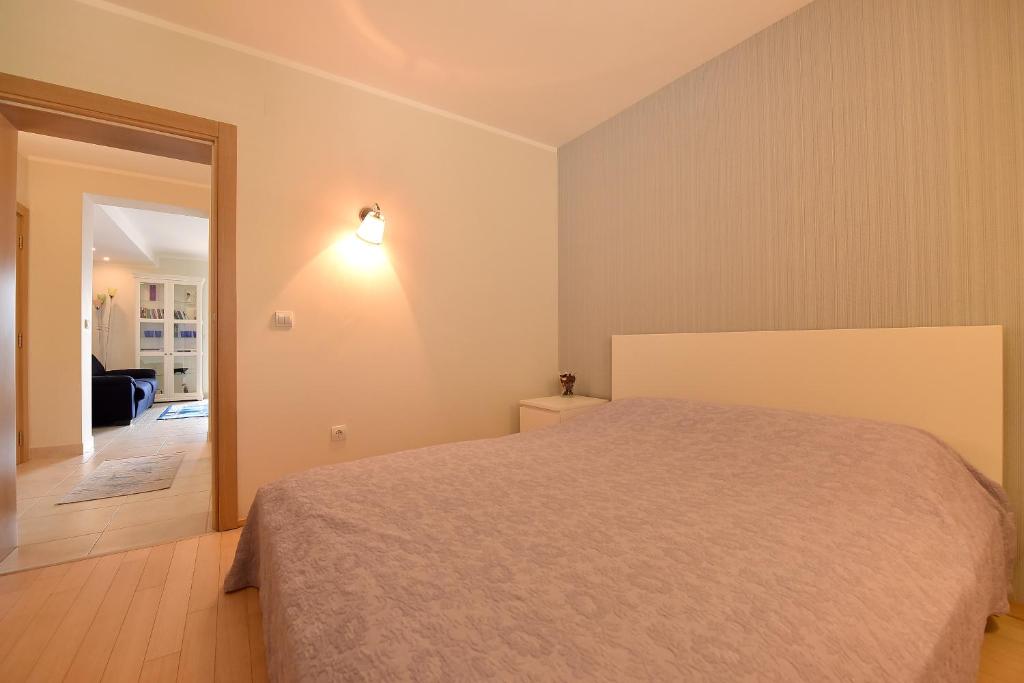 Ένα ή περισσότερα κρεβάτια σε δωμάτιο στο Apartment Maniva