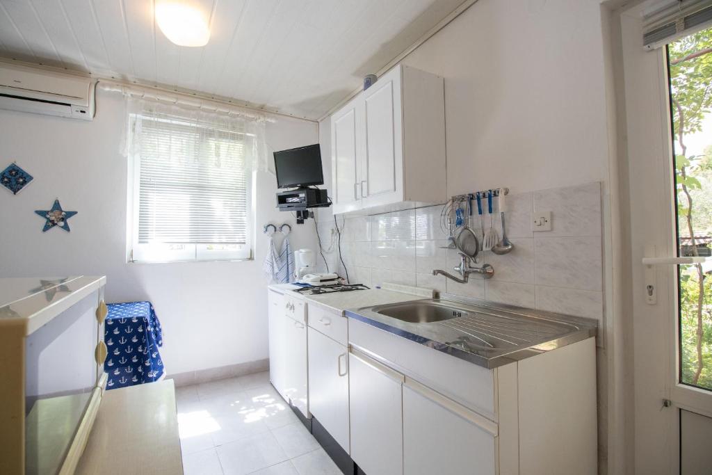 Kuchyň nebo kuchyňský kout v ubytování Apartment Miroslav