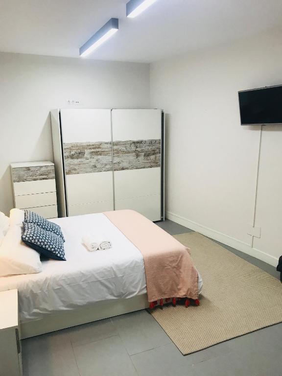 Postel nebo postele na pokoji v ubytování Apartamento Kasa Tomas Gros