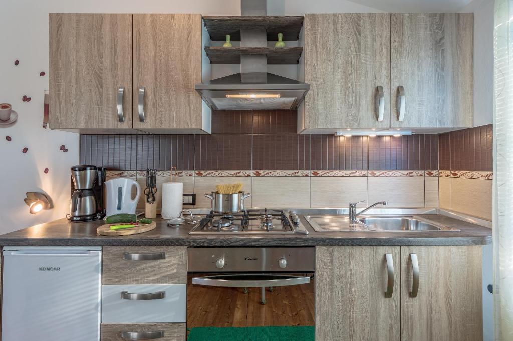 Kuchyň nebo kuchyňský kout v ubytování Apartment San