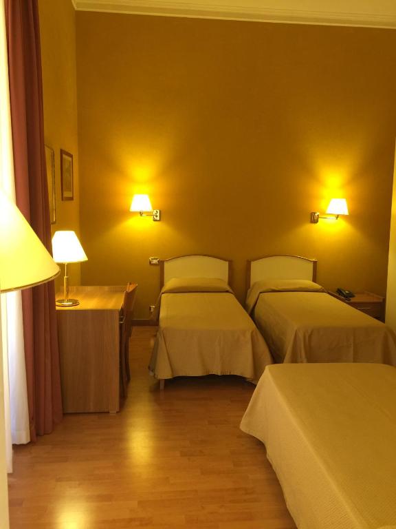 Postel nebo postele na pokoji v ubytování Hotel Relais Filonardi