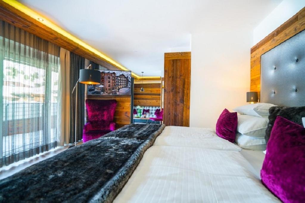 Postel nebo postele na pokoji v ubytování Sporthotel Cinderella