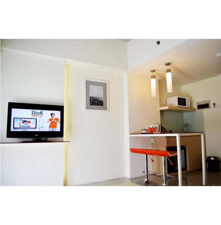 TV a/nebo společenská místnost v ubytování HARRIS Hotel & Residences Sunset Road