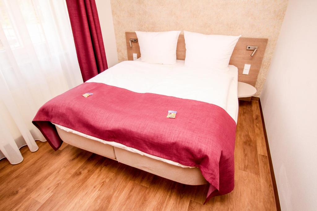 Postel nebo postele na pokoji v ubytování Hotel Ohlendorfs Gasthaus