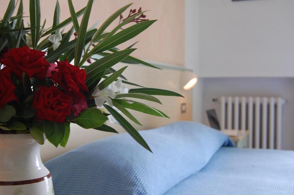 Postel nebo postele na pokoji v ubytování Hotel Rivamare