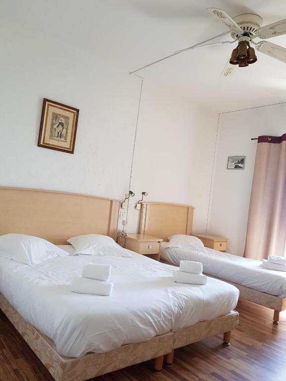 Postel nebo postele na pokoji v ubytování Hotel Ariana