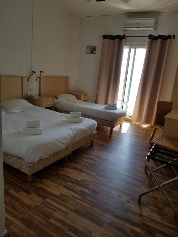 Postel nebo postele na pokoji v ubytování Hotel Ariana