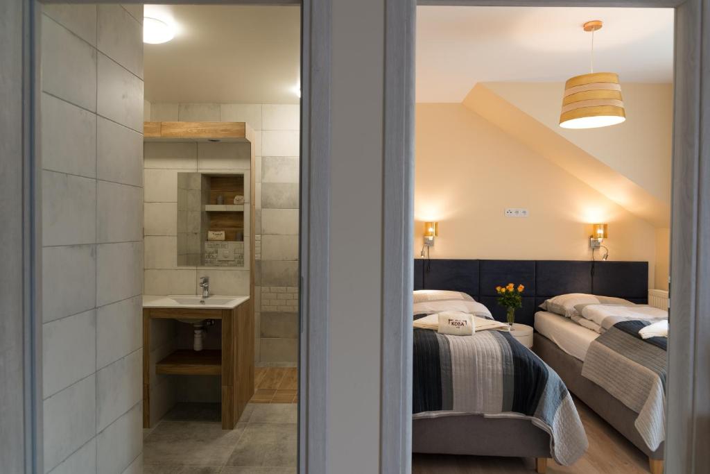 Posteľ alebo postele v izbe v ubytovaní Apartamenty Koba