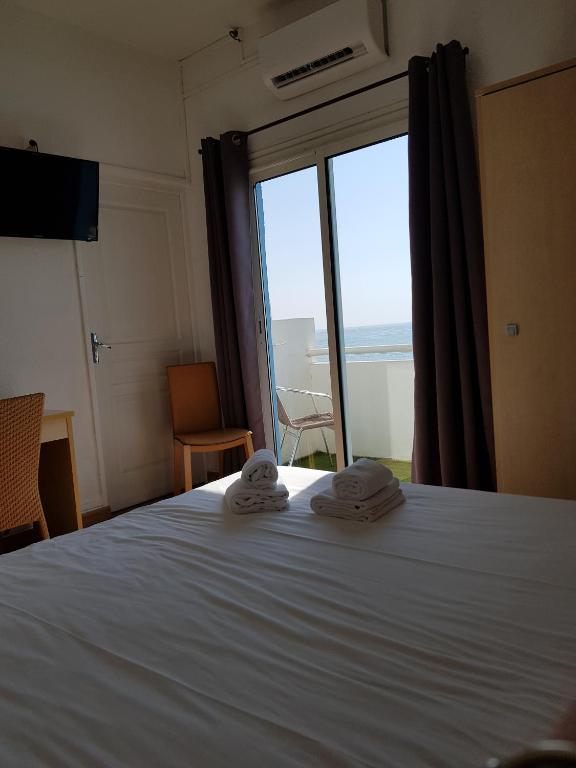 Postel nebo postele na pokoji v ubytování Hotel Ariana