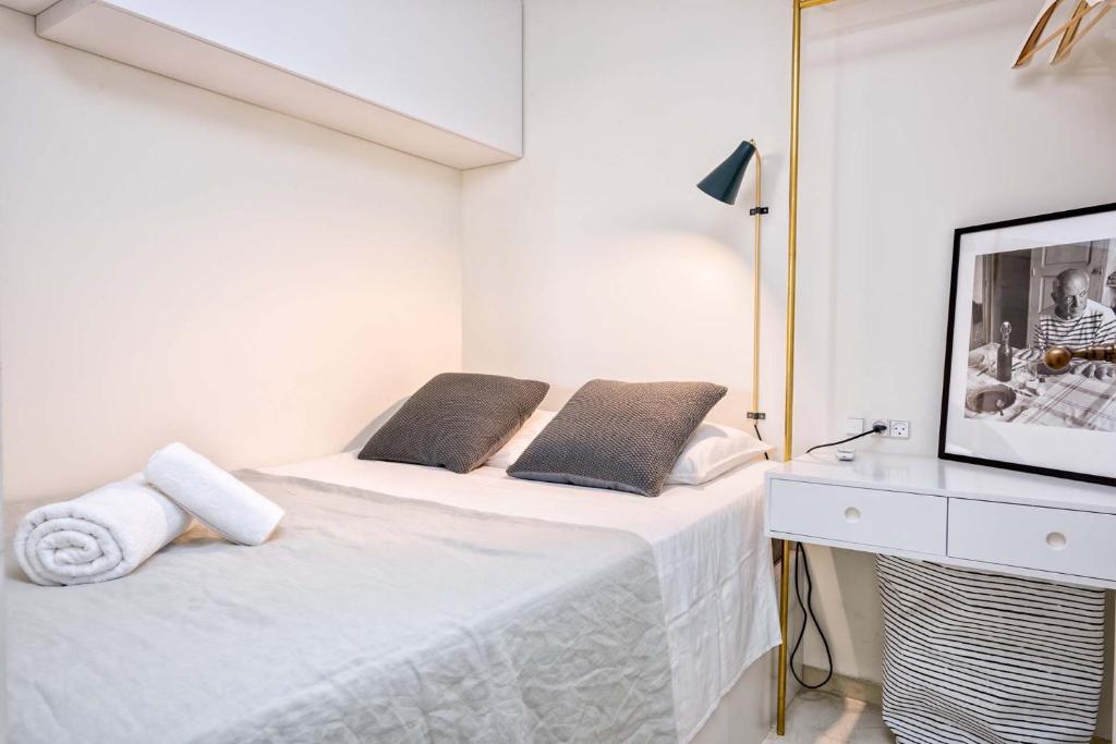 Posteľ alebo postele v izbe v ubytovaní Sagrado Corazon Penthouse in Malaga by Solaga Holiday Homes