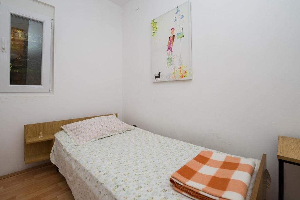 Postel nebo postele na pokoji v ubytování Ilas Dugi Otok