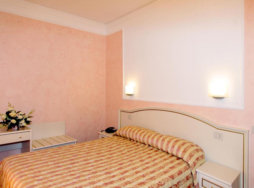Postel nebo postele na pokoji v ubytování Hotel divino Amore