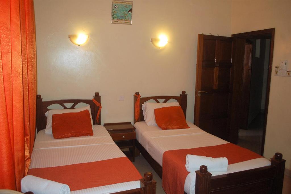 Postel nebo postele na pokoji v ubytování Regency Park Hotel