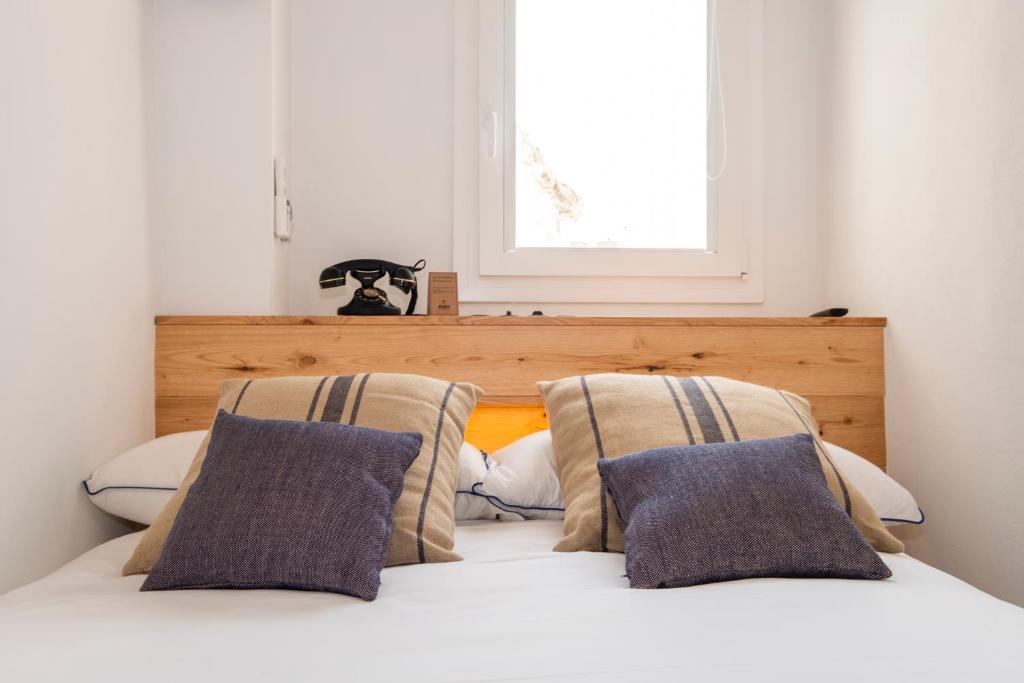 Postel nebo postele na pokoji v ubytování Nao Catedral Boutique Hotel