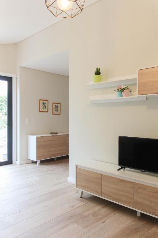 TV a/nebo společenská místnost v ubytování Garden House Ramalde