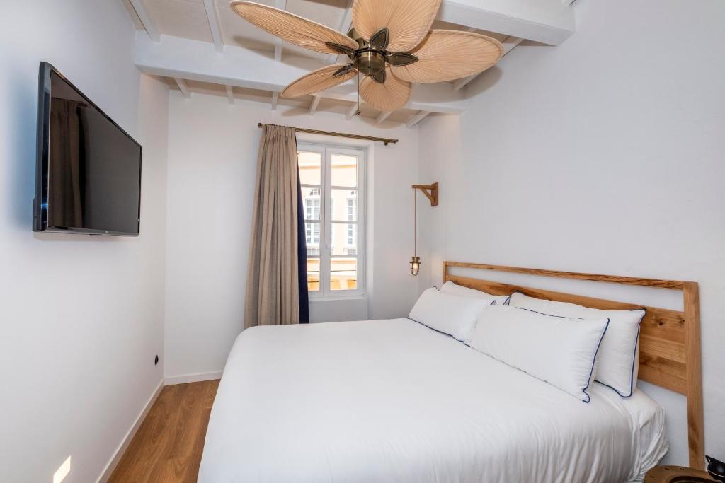 Postel nebo postele na pokoji v ubytování Nao Catedral Boutique Hotel