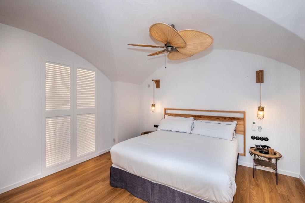 Postel nebo postele na pokoji v ubytování Nao Catedral Boutique Hotel