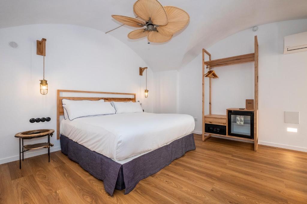Postel nebo postele na pokoji v ubytování Nao Catedral Boutique Hotel