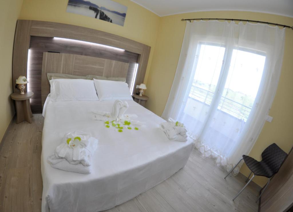 Postel nebo postele na pokoji v ubytování Cataleya Resort & Spa