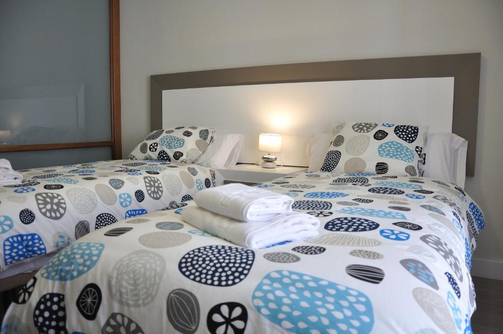 Postel nebo postele na pokoji v ubytování Apartamentos Sábora