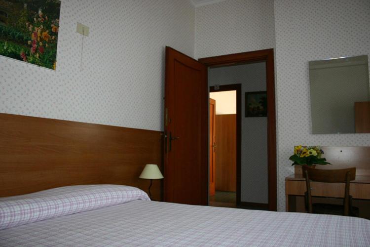 Postel nebo postele na pokoji v ubytování Albergo Anna
