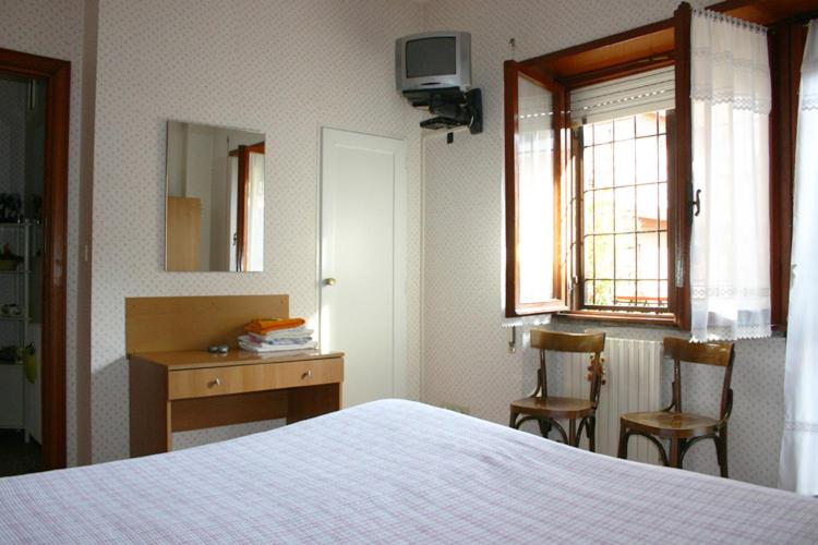 Postel nebo postele na pokoji v ubytování Albergo Anna