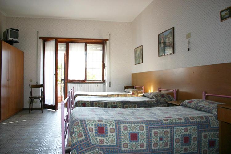 Postel nebo postele na pokoji v ubytování Albergo Anna