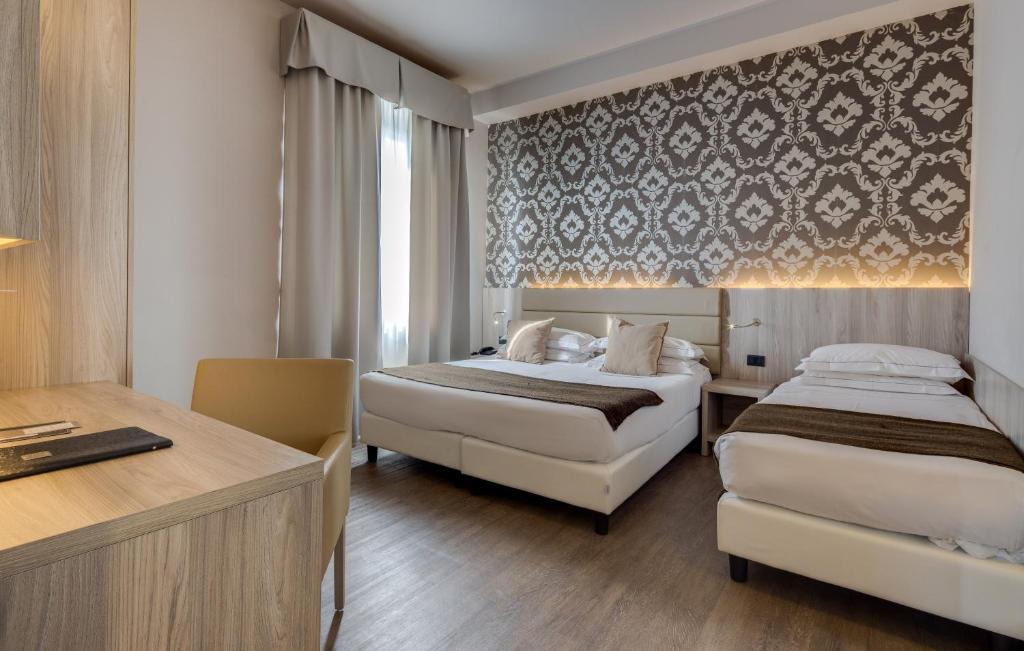 Posteľ alebo postele v izbe v ubytovaní Hotel San Marco & Formula Club