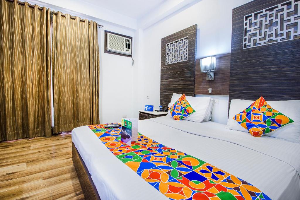 Postel nebo postele na pokoji v ubytování Hotel Sunstar Heights