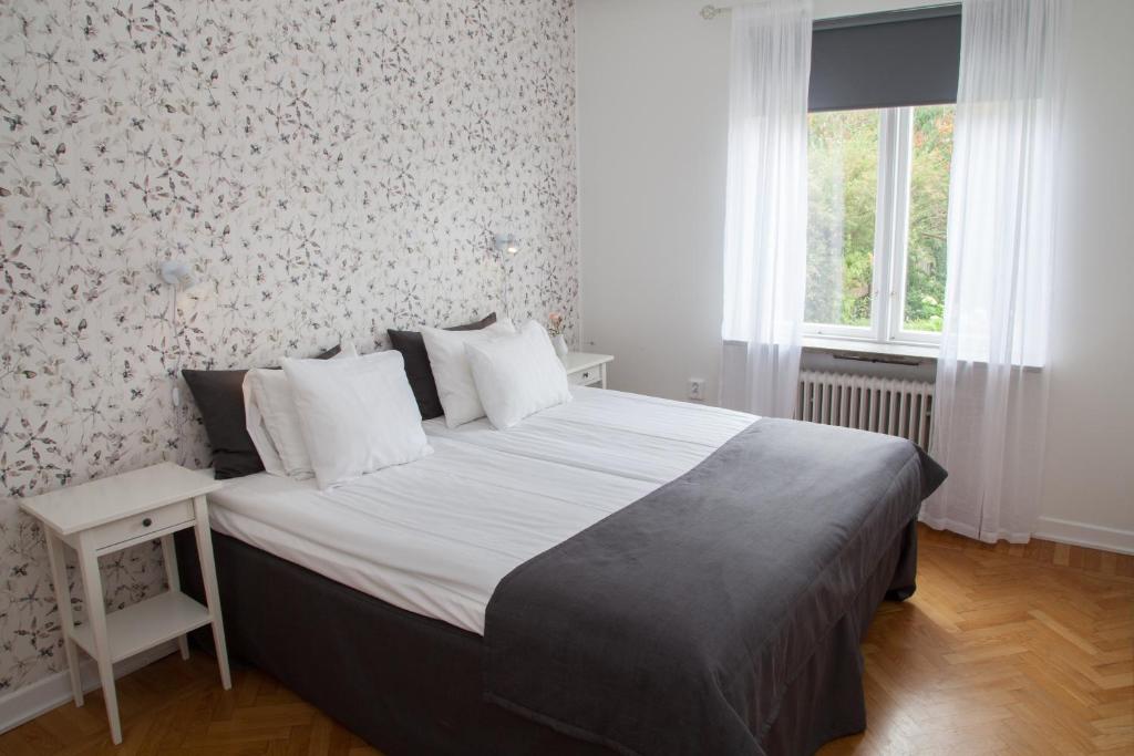 Postel nebo postele na pokoji v ubytování Hotell Conrad