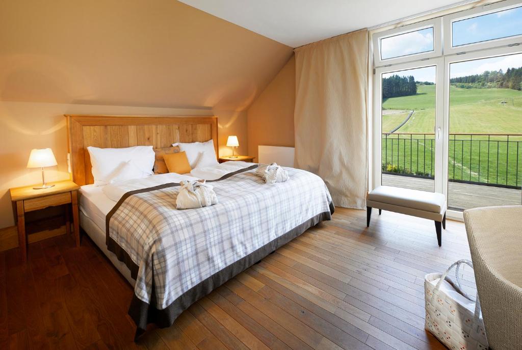 Postel nebo postele na pokoji v ubytování Hotel Rimberg