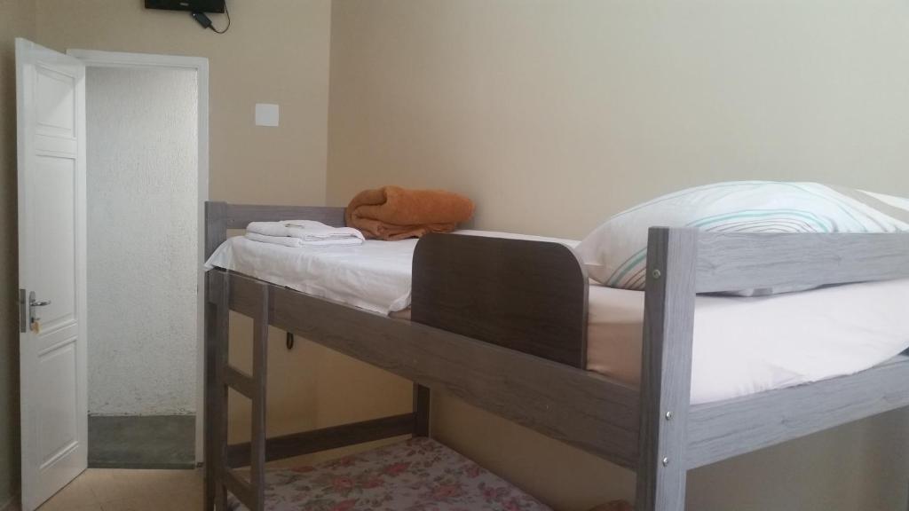 Łóżko lub łóżka w pokoju w obiekcie Hotel Itajuba