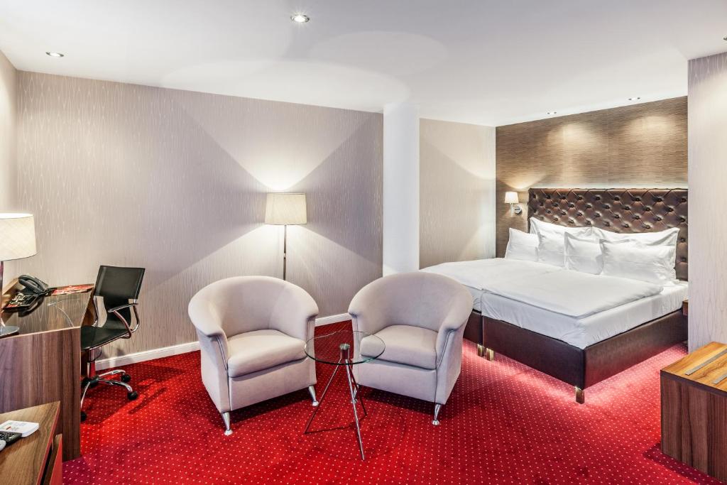 Uma cama ou camas num quarto em Pytloun City Boutique Self Check-in Hotel