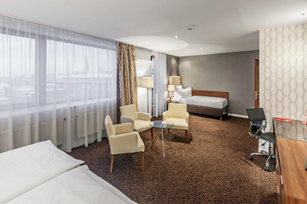 Uma cama ou camas num quarto em Pytloun City Boutique Self Check-in Hotel