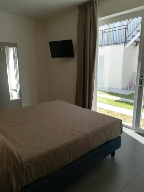Postel nebo postele na pokoji v ubytování Garda Guest House