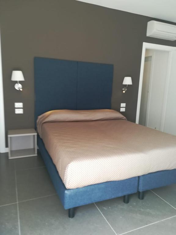 Postel nebo postele na pokoji v ubytování Garda Guest House