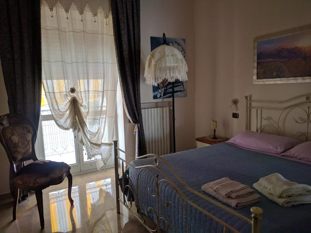 Postel nebo postele na pokoji v ubytování Casa Maddalena family