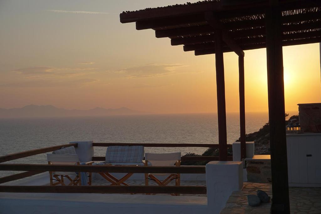 a view of the ocean at sunset from a resort at Antiparos Vibes in Agios Georgios