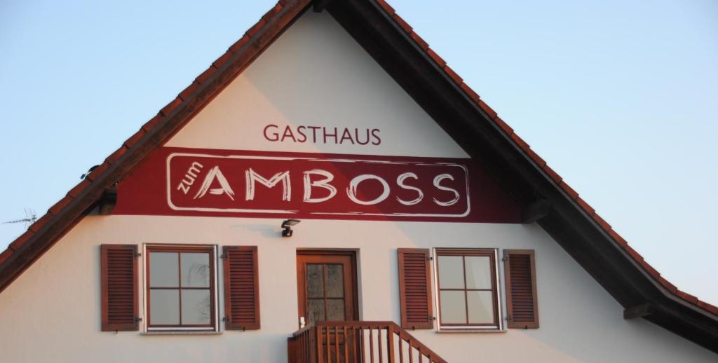 a building with a sign that reads cassius amnesia at Altbau Gasthaus Amboss in Grünkraut