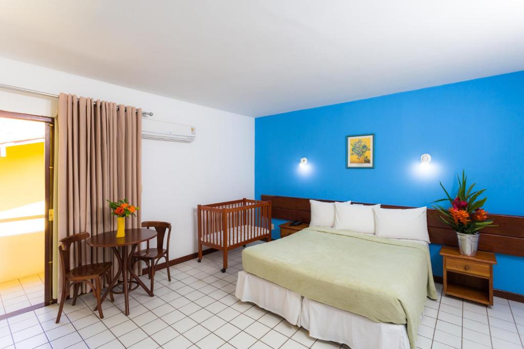 Postel nebo postele na pokoji v ubytování Sunshine Praia Hotel