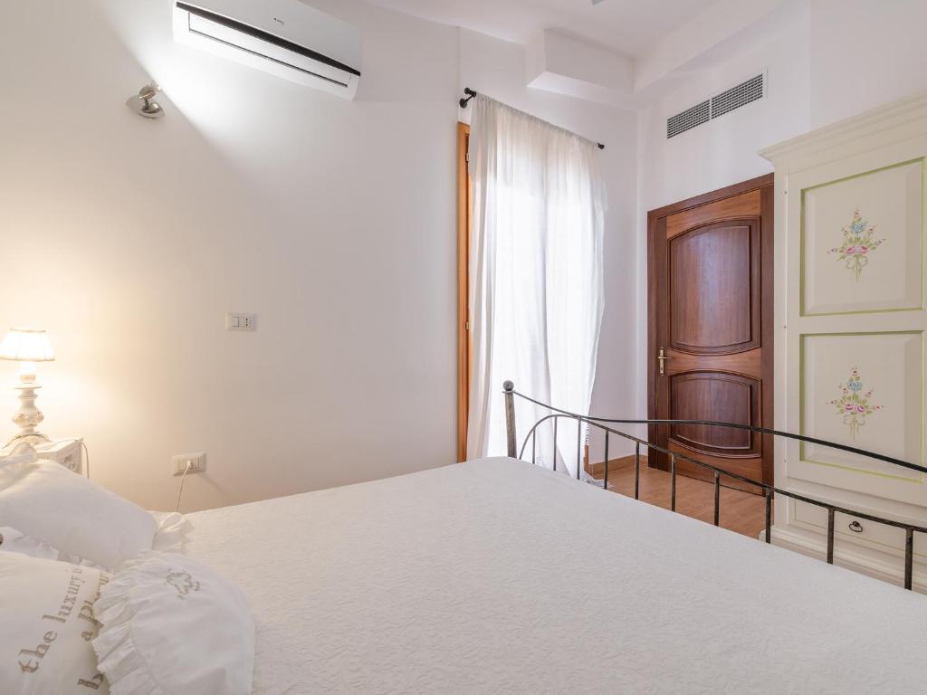 Postel nebo postele na pokoji v ubytování Villa Iole