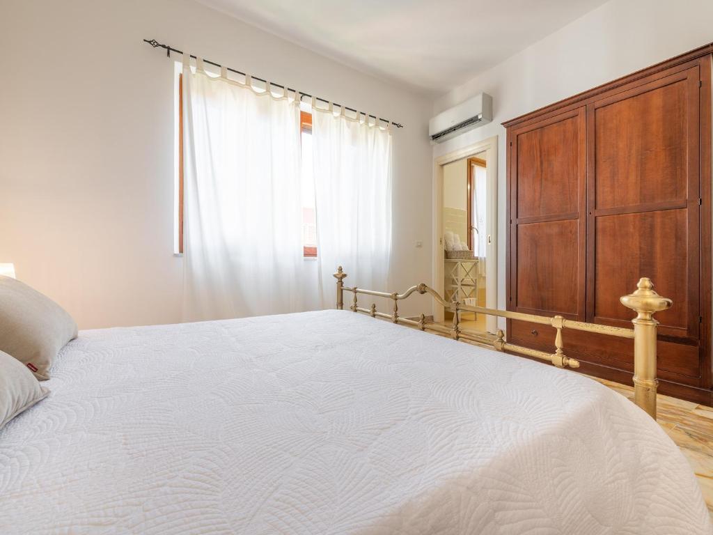 Postel nebo postele na pokoji v ubytování Villa Iole