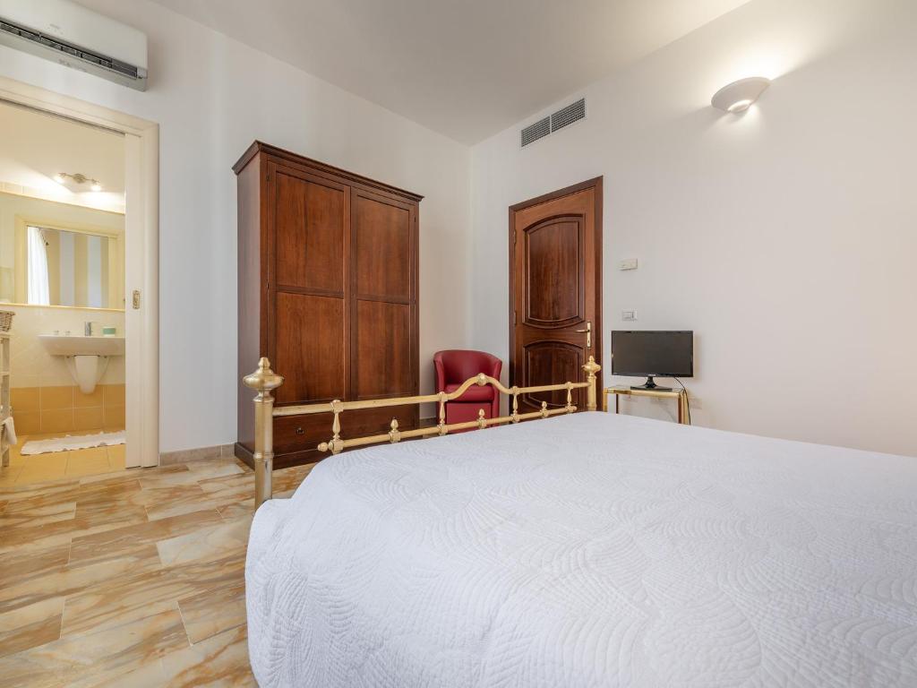 Postel nebo postele na pokoji v ubytování Villa Iole