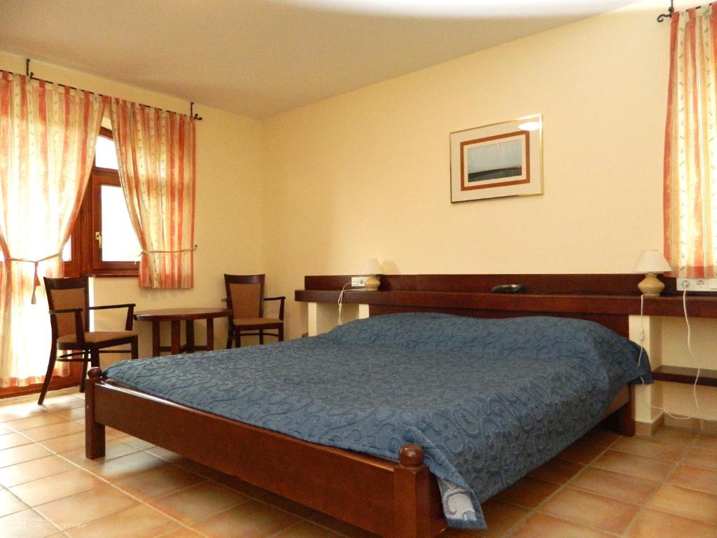 Postel nebo postele na pokoji v ubytování Club Dobogómajor superior