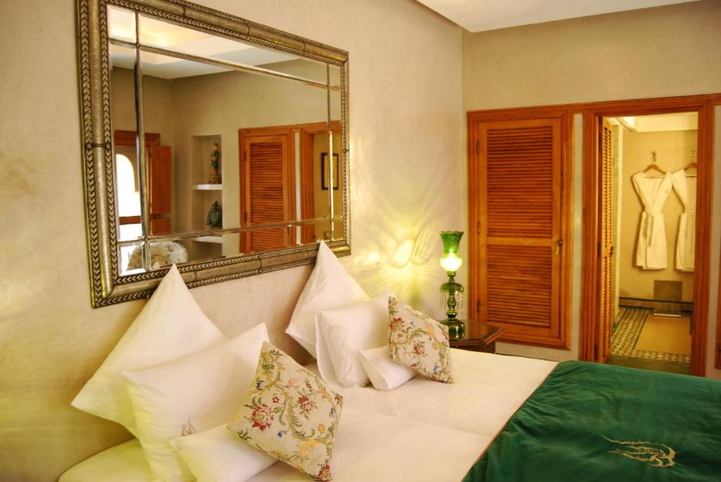 Postel nebo postele na pokoji v ubytování Riad Flam & Spa