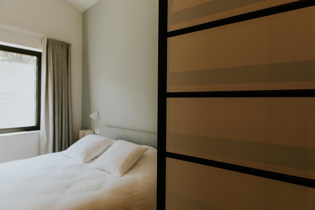 Postel nebo postele na pokoji v ubytování Hotel Jerom