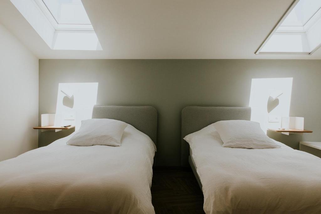 Postel nebo postele na pokoji v ubytování Hotel Jerom
