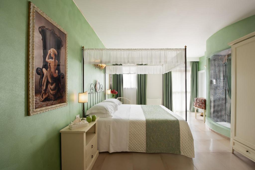 Postel nebo postele na pokoji v ubytování Hotel Corsignano