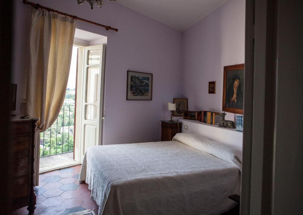 Posteľ alebo postele v izbe v ubytovaní Dimora Il Palazzetto