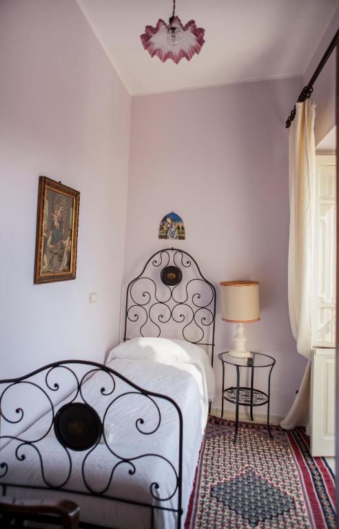 Posteľ alebo postele v izbe v ubytovaní Dimora Il Palazzetto